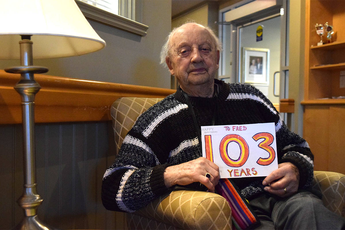 John Fred Jauck with one of this year’s birthday cards at the Trillium Highgate Lodge. (Kiernan Green / Victoria News Staff)