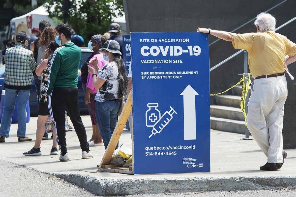 People line up to get their COVID-19 vaccine at a vaccination centre, Thursday, June 10, 2021 in Montreal. THE CANADIAN PRESS/Ryan Remiorz