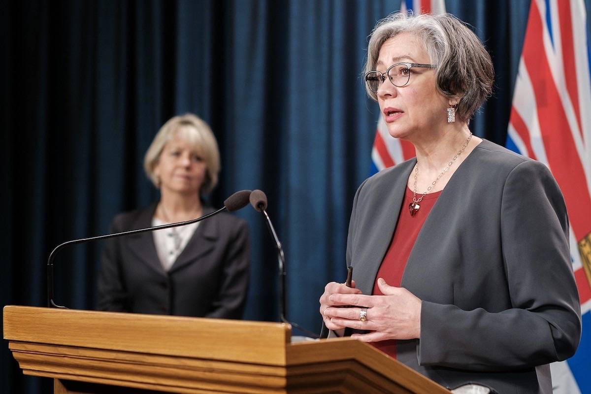 FILE – Provincial health officer Dr. Bonnie Henry listens as B.C. Education Minister Jennifer Whiteside describes new mask wearing policy for public schools, Feb. 4, 2021. (B.C. government)