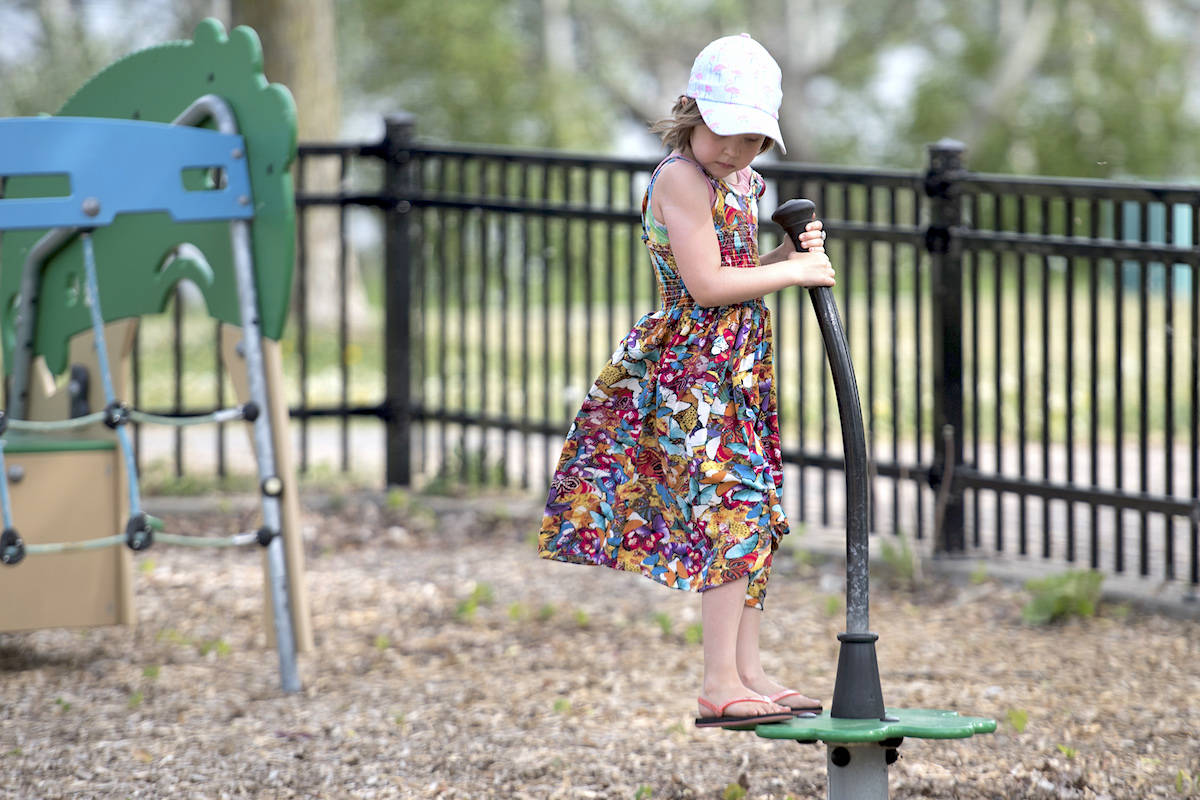 Seven-year-old Eva Mailhot Maclean plays in a playground in Montreal, Saturday, May 30, 2020. THE CANADIAN PRESS/Graham Hughes