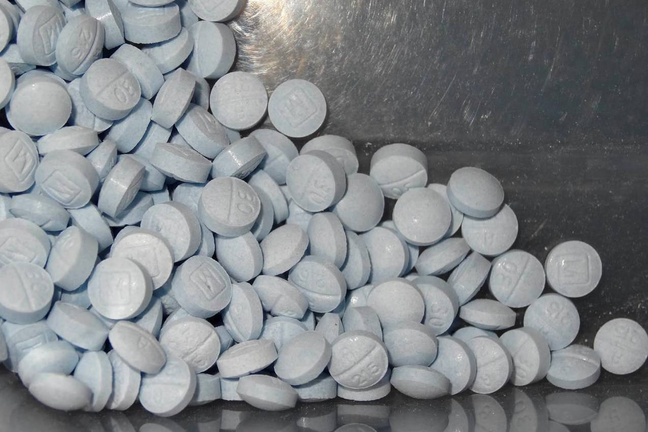 This photo provided by the U.S. Attorney’s Office for Utah and introduced as evidence in a 2019 trial shows fentanyl-laced fake oxycodone pills collected during an investigation. Canada’s public health agency says the COVID-19 pandemic drove an increasingly deadly overdose crisis last year that continues to take lives and corrode communities. THE CANADIAN PRESS/AP-U.S. Attorneys Office for Utah via AP