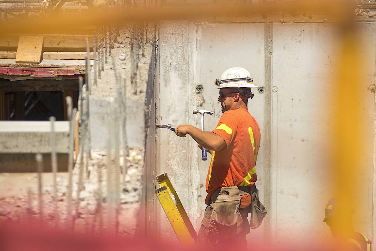 Men work at a construction site in downtown Toronto, on Thursday, June 30, 2016. (THE CANADIAN PRESS/Eduardo Lima)