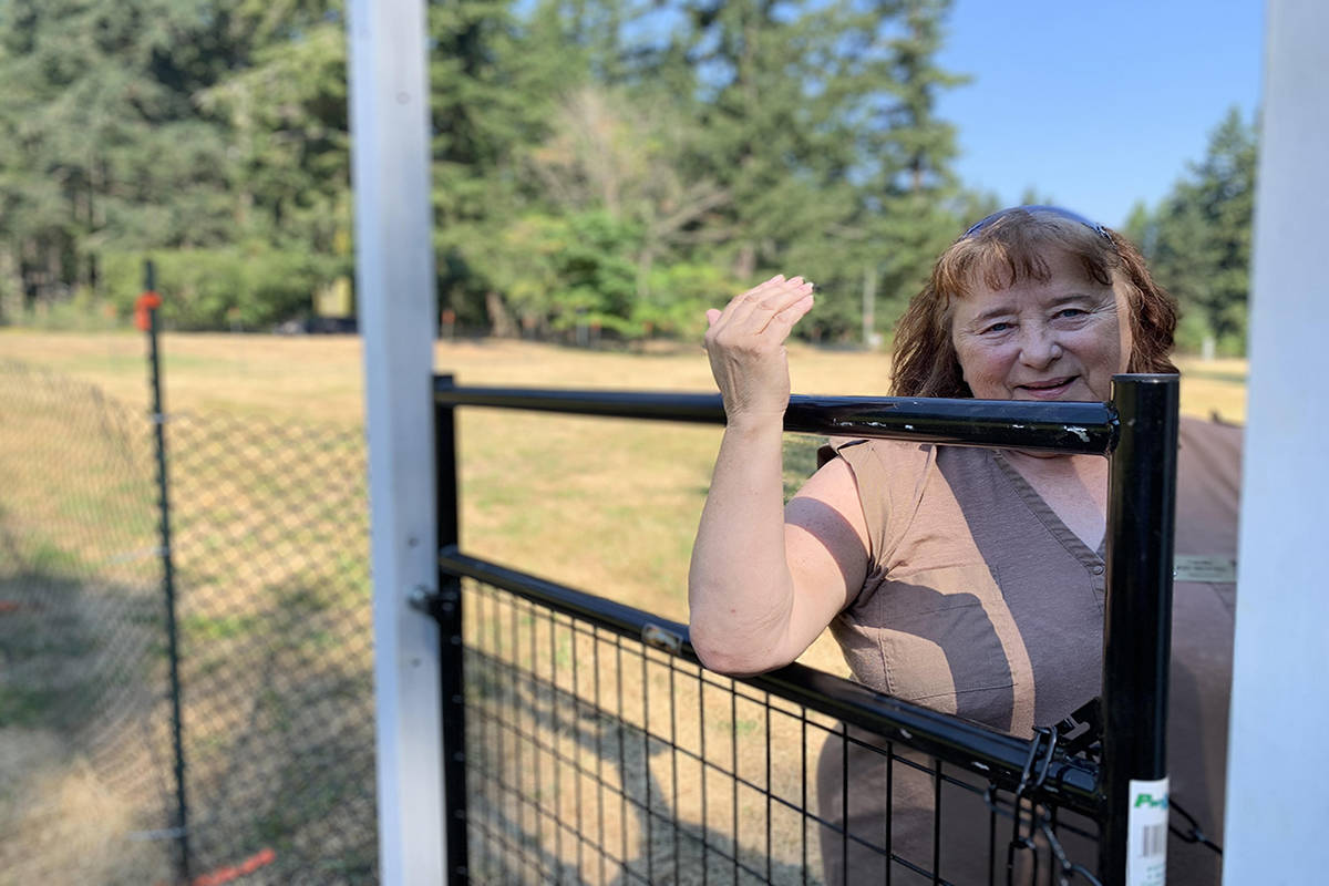 Coun. Judy Brownoff welcomes dog owners to Fowler Park on June 29, the first official day of Paws in Parks fenced pop-up pilot project. (Megan Atkins-Baker/News Staff)