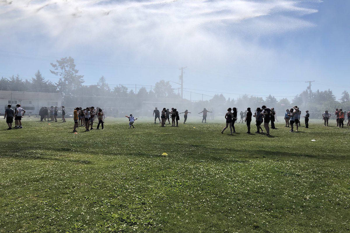The North Saanich fire department gave local students a cool break Monday as temperatures soared well past 30 C. (Photo courtesy of North Saanich Middle School/Twitter)