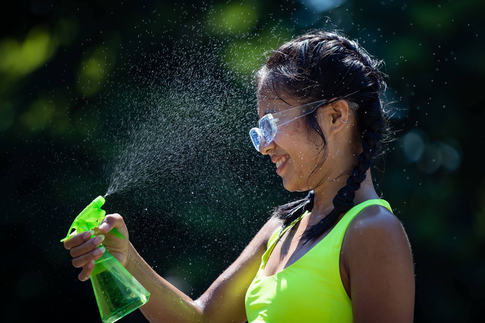 Leanne Opuyes uses a spray bottle to mist her face while cooling off in the frigid Lynn Creek water in North Vancouver, B.C., on Monday, June 28, 2021. Environment Canada warns the torrid heat wave that has settled over much of Western Canada won’t lift for days, although parts of British Columbia and Yukon could see some relief sooner. THE CANADIAN PRESS/Darryl Dyck