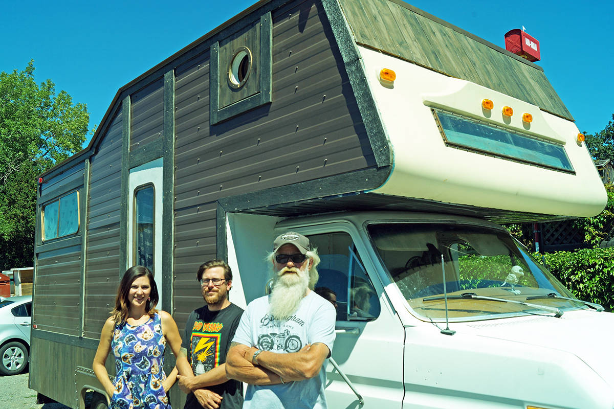 Catherine Richard, left, Chris Laxton, and Langford resident Mark Peterson with the RV the couple rebuilt with some neighbourly assistance from Peterson and the community. (Rick Stiebel/News Staff)