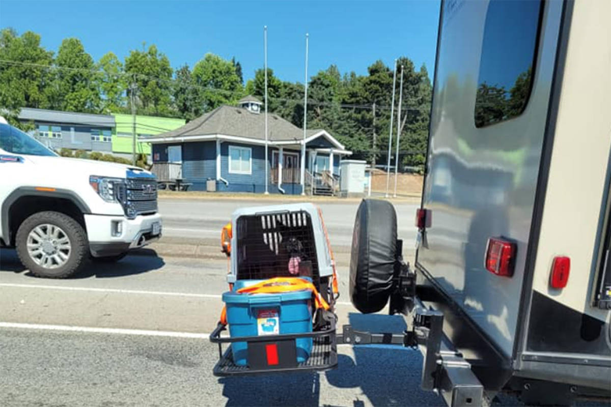 Residents across B.C. were infuriated and horrified after photos of a dog being carried in a crate behind an RV in the Interior during the province’s record breaking heatwave were posted to social media Sunday, June 27. (Heather Peters/Facebook photo)