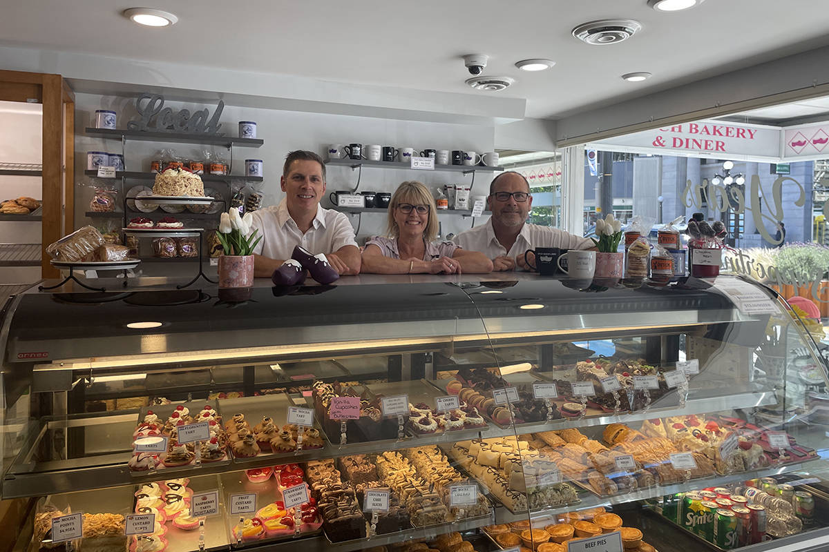 Head baker Brook Schaddelee, (from left), manager Michele Byrne and chocolatier Jack Schaddelee smile behind the counter at the Dutch Bakery and Diner. The establishment has operated for 65 years and the current operators still use the traditional European recipes of grandfather and founder Kees Schaddelee. (Courtesy of Dutch Bakery and Diner)