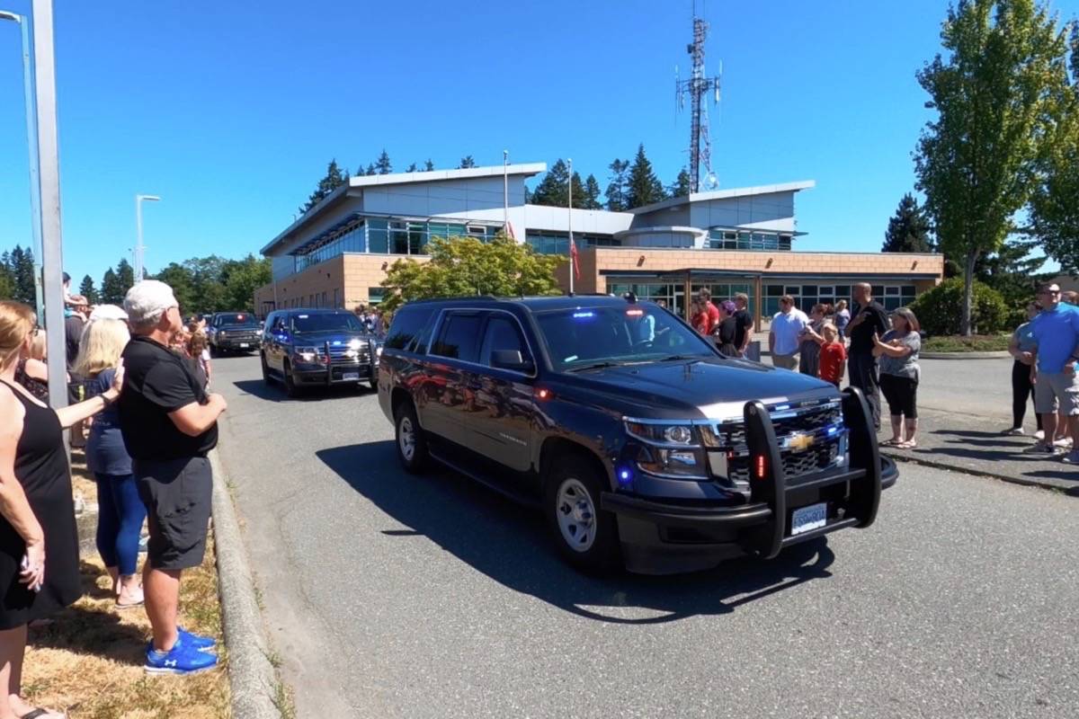 The vehicle procession to honour Gator started at the Campbell River RCMP detachment on Dogwood Street. Photo by Sean Feagan / Campbell River Mirror