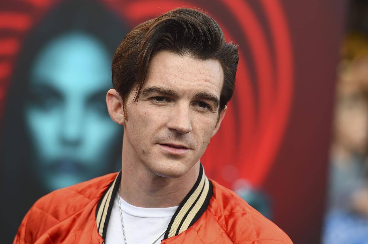 FILE - Drake Bell appears at the world premiere of “The Spy Who Dumped Me” in Los Angeles on July 25, 2018. Bell is scheduled to be sentenced Monday, July 12, 2021 in Cleveland to charges relating to a teen whom he met online and who attended one of his concerts in 2017 when she was 15. The 34-year-old Bell, of West Hollywood, California, pleaded guilty last month to a felony county of attempted child endangerment and a misdemeanor count of disseminating matter harmful to juveniles. (Photo by Jordan Strauss/Invision/AP, File)