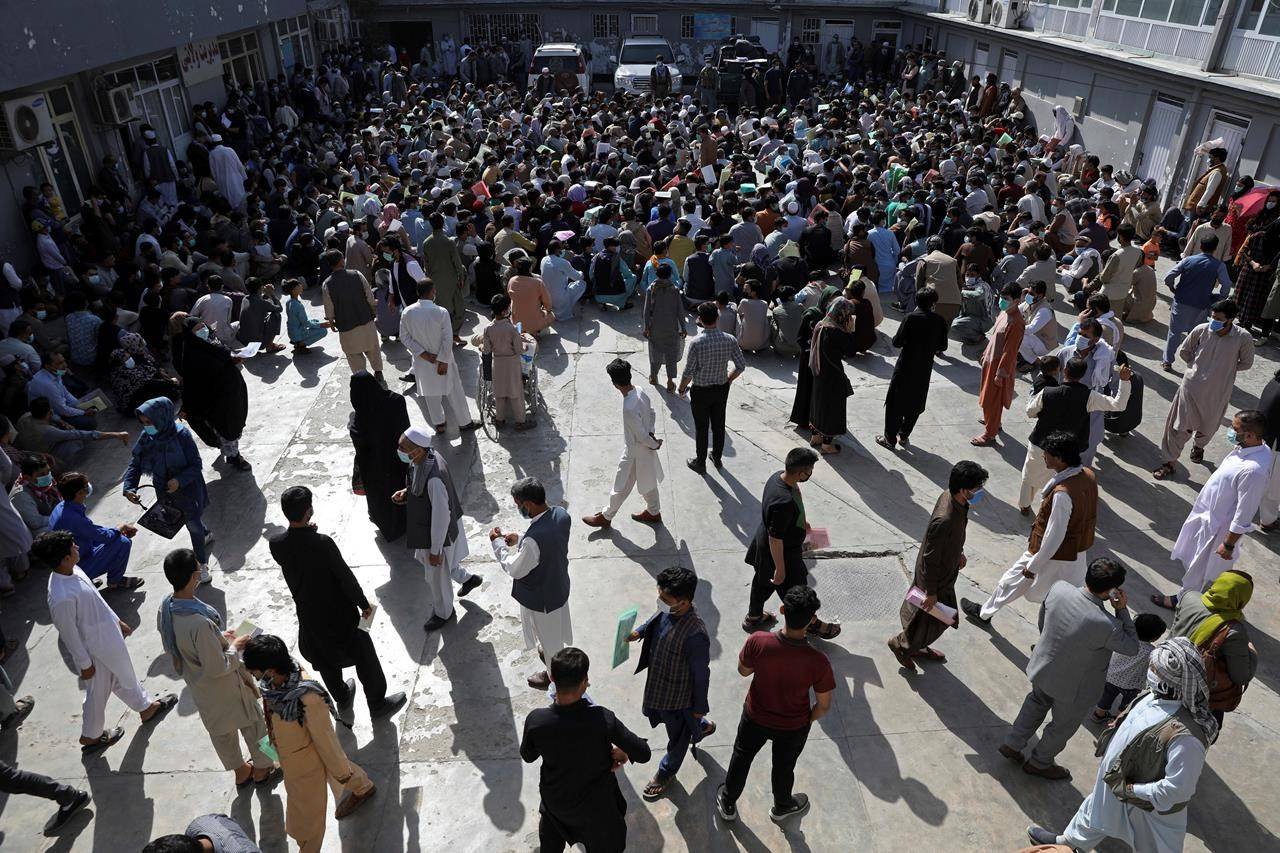 Afghans wait inside the passport office in Kabul, Afghanistan, Wednesday, June 30, 2021. Ottawa will continue sending humanitarian and development assistance to Afghanistan after the United States completes its troop withdrawal from the country next month, International Development Minister Karina Gould says. U.S. President Joe Biden said last week the U.S. military operation in Afghanistan will end Aug. 31, nearly 20-year after the United States and its allies took down the Taliban government in Kabul. THE CANADIAN PRESS/AP, Rahmat Gul