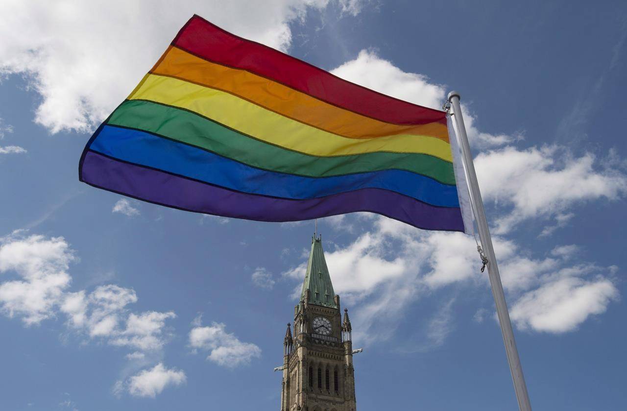 The pride flag flies following a raising ceremony on Parliament Hill Wednesday June 1, 2016 in Ottawa. THE CANADIAN PRESS/Adrian Wyld