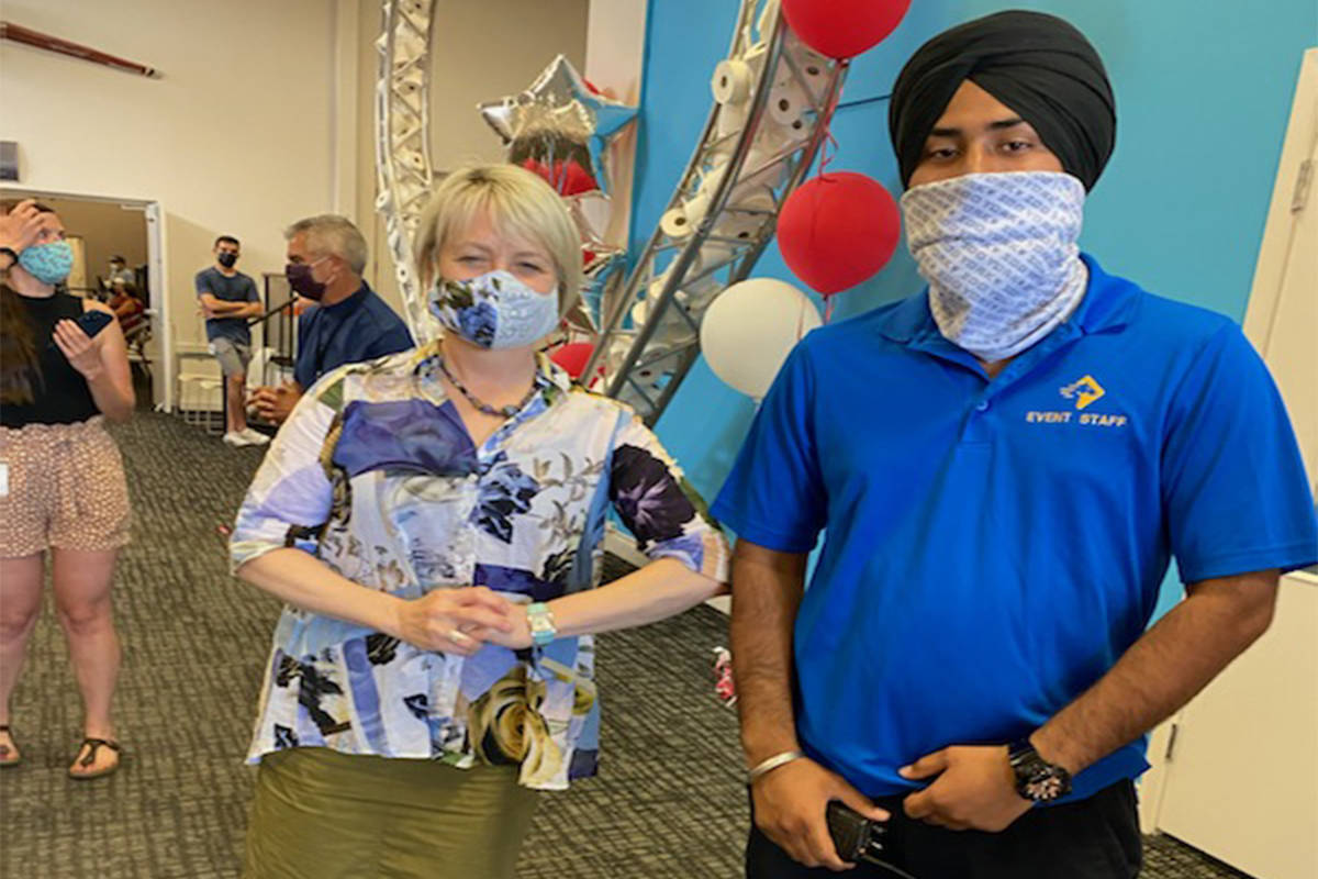 Dr. Bonnie Henry is pictured with Anmol, who was attacked in a racist tirade earlier this week. Henry visited Trinity Baptist Church, a vaccination site last month. (Paladin Security/Twitter)