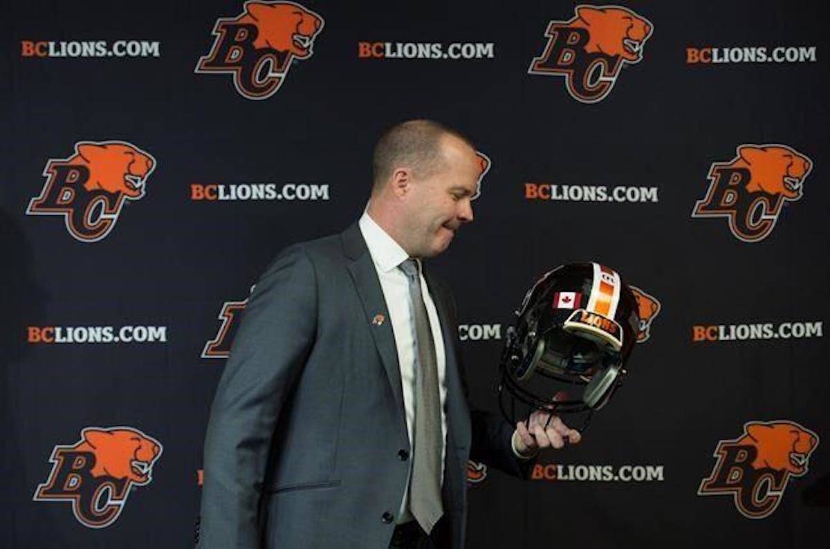 B.C. Lions’ new head coach Rick Campbell holds a team helmet after being introduced to the media during a news conference at the team training facility in Surrey, B.C., Monday, Dec. 2, 2019. THE CANADIAN PRESS/Jonathan Hayward