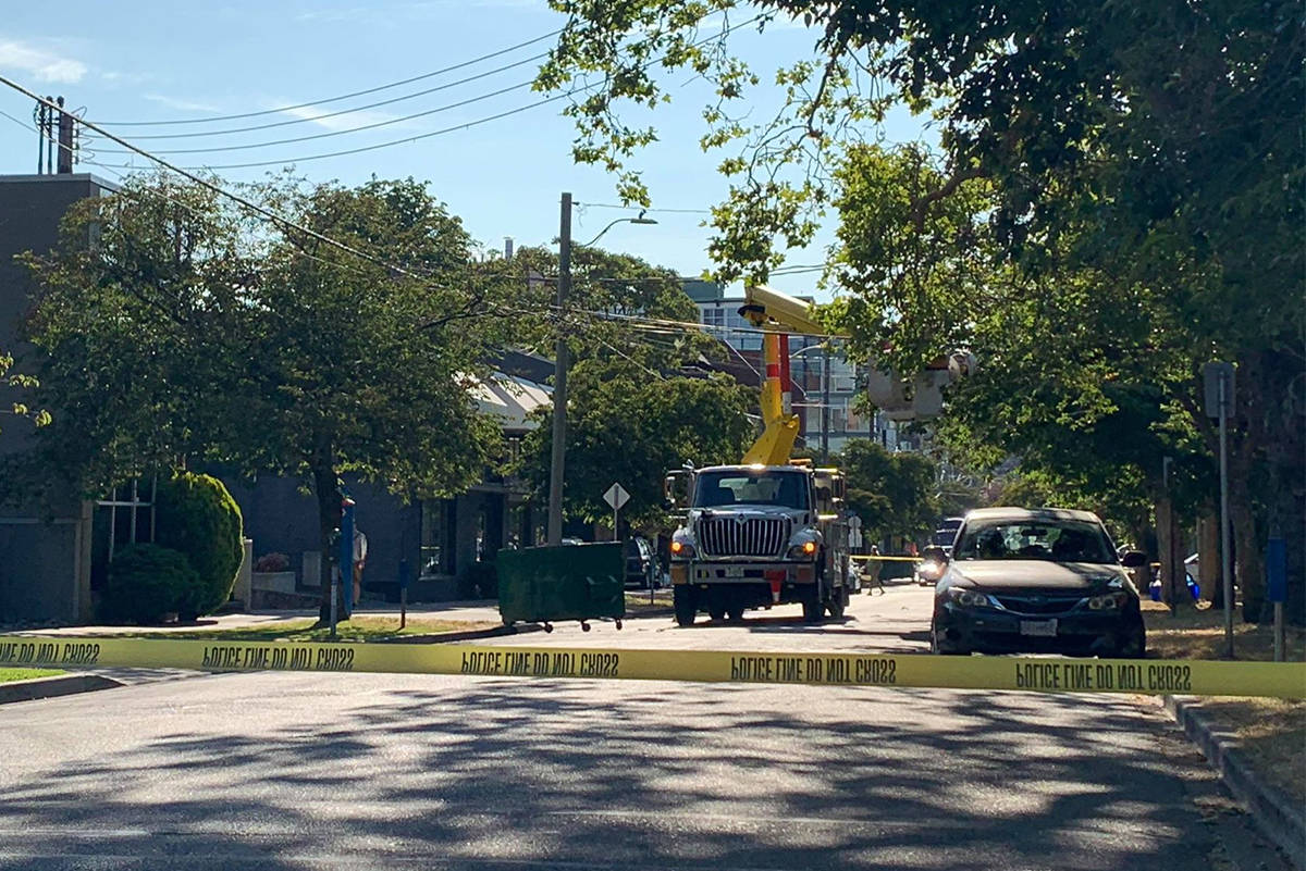 Emergency crews were called after a garbage truck struck a utility line in Victoria on Wednesday. (Kiernan Green/News Staff)