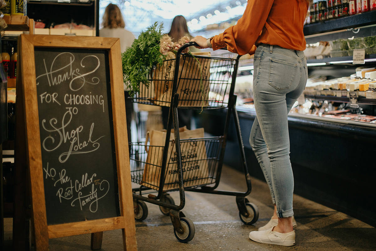 Customers fill their carts at The Root Cellar store on McKenzie Avenue. Daisy and Adam Orser opened the location 13 years ago and are working on transforming the former Oxford Foods in Cook Street Village into theiir second store. (Emma Rossum Photography)