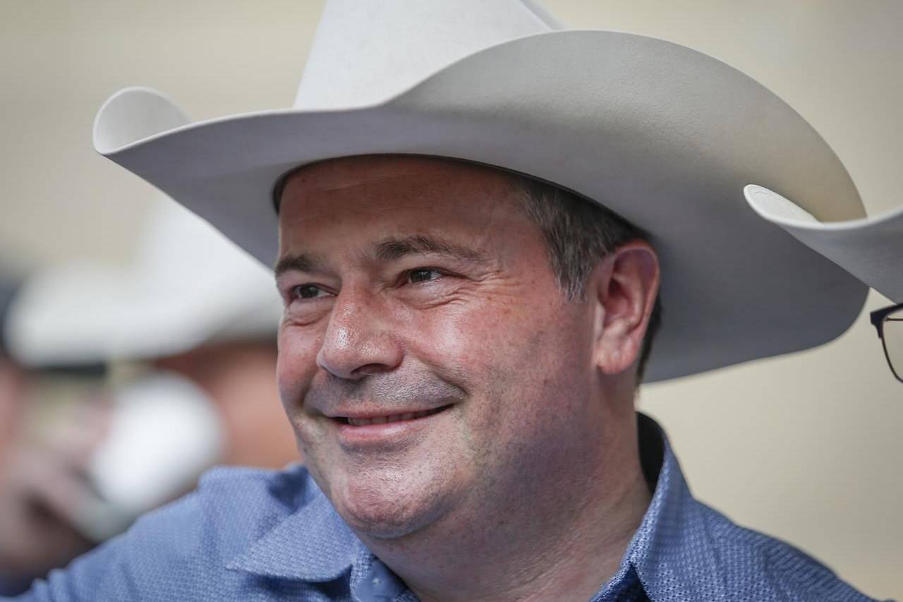 Alberta Premier Jason Kenney poses for a photo as he hosts the Premier's annual Stampede breakfast in Calgary, Alta., Monday, July 12, 2021. Kenney will provide details on Alberta's film and television industry this afternoon, speaking publicly for the first time since significant changes were made to COVID-19 protections in the province. THE CANADIAN PRESS/Jeff McIntosh