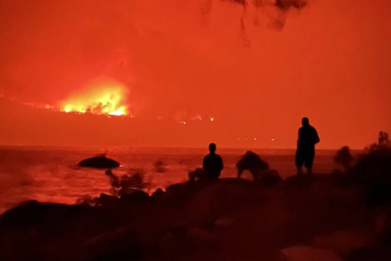 A view of the White Rock Lake wildfire from Ellison Provincial Park on Aug. 6. A recent poll suggests British Columbians are the most concerned about climate change in Canada. (@mkinz - Twitter)