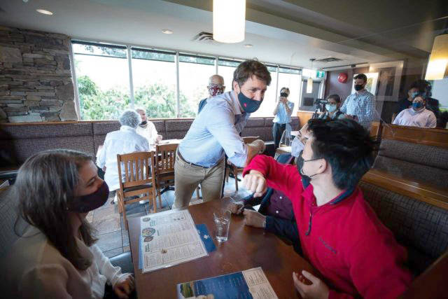 Prime Minister Justin Trudeau greets people having lunch at a White Spot restaurant in Coquitlam, B.C., on July 8. Canadian party leaders are working worked their way around the country, in what some see as the proof they needed that a federal election is on its way. (Darryl Dyck - The Canadian Press)