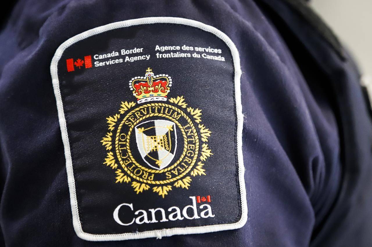 A Canada Border Services Agency (CBSA) patch is seen on an officer in Calgary, Alberta. (THE CANADIAN PRESS/Jeff McIntosh)
