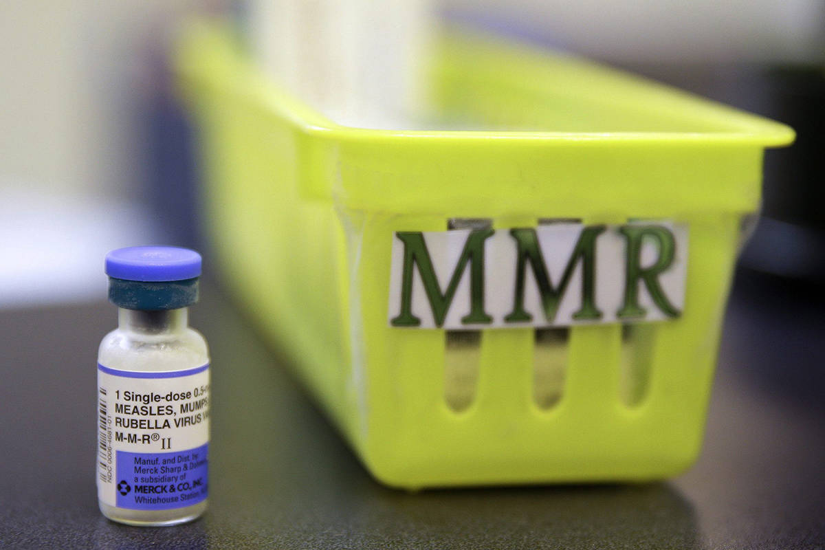 FILE - This Feb. 6, 2015, file photo shows a Measles, Mumps and Rubella, M-M-R vaccine on a countertop at a pediatrics clinic in Greenbrae, Calif. (AP Photo/Eric Risberg, File)