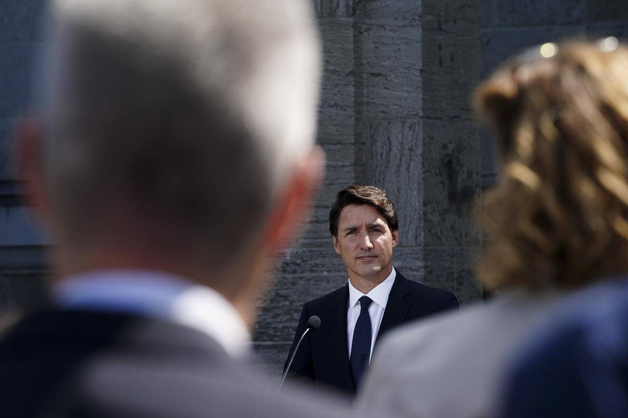 Reporters as questions as Prime Minister Justin Trudeau holds a press conference after meeting with Governor General Mary Simon and triggering an election at Rideau Hall in Ottawa on Sunday, Aug 15. (THE CANADIAN PRESS/Sean Kilpatrick)