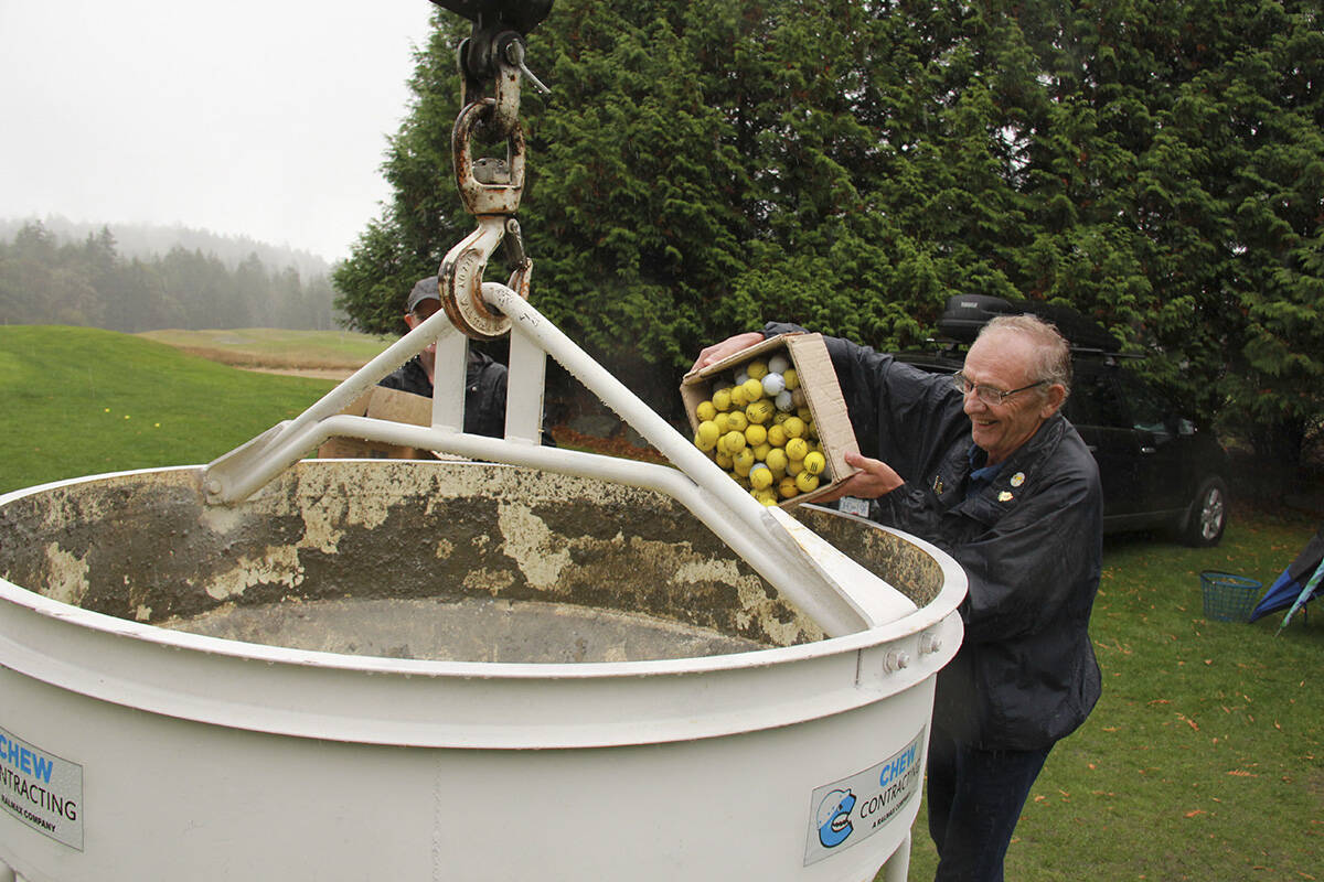 West Shore Rotary Club member Jim Tenhove unloads a box of golf balls into a crane bucket for the club’s Golf Ball Drop fundraiser last year. This year’s drop happens this Wednesday (Sept. 8) at 6:30 p.m. (Jane Skrypnek/News Staff)