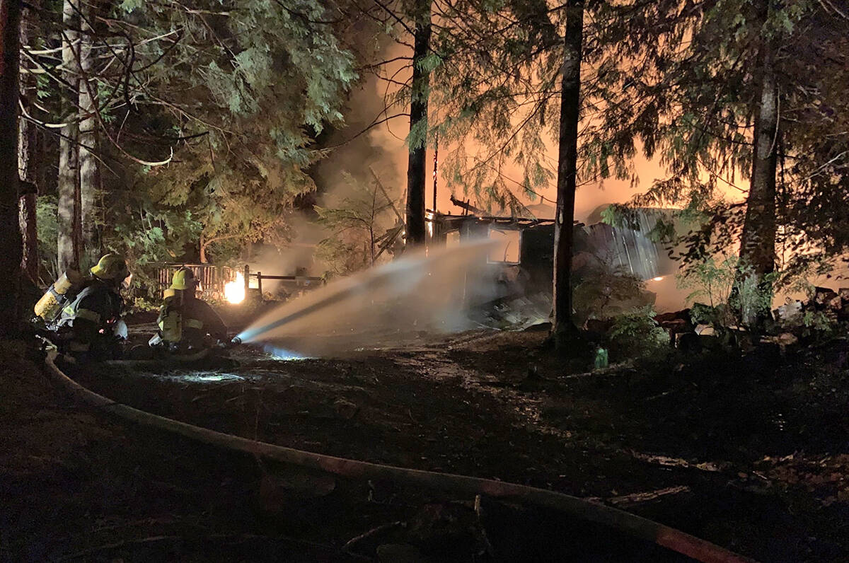 Firefighters tackle a structure fire that destroyed a home on Willowbrae Road on Friday night. (Photo courtesy of Rick Geddes)
