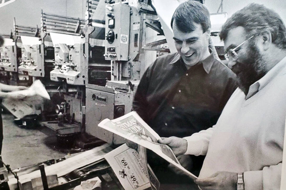 George Manning (right), seen here in the pressroom of one of the publications he oversaw, was a legendary figure and mentor in the local community newspaper industry. He passed away last week at age 81. (Facebook/Gail Manning)