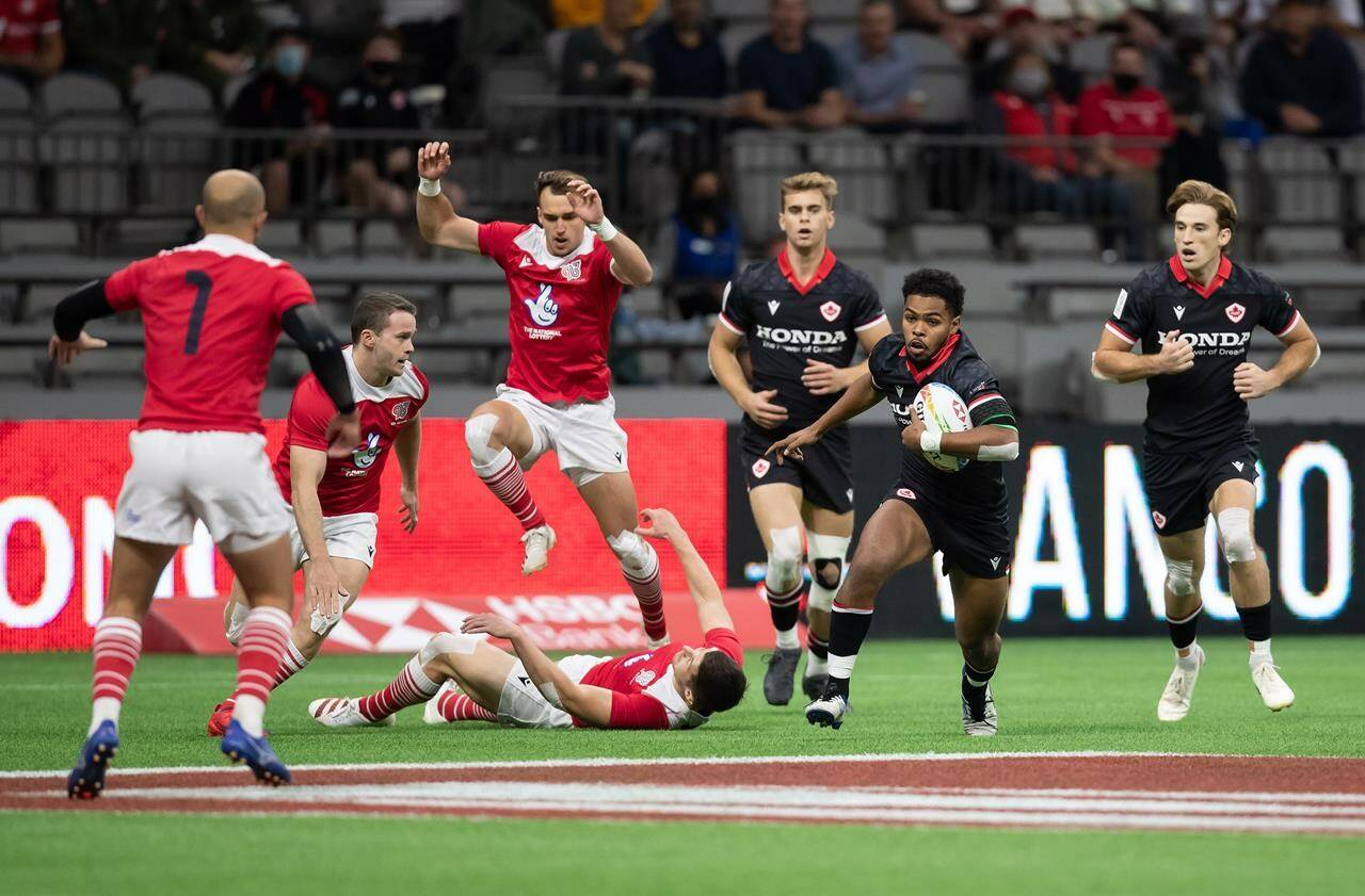 Canada’s Josiah Morra, second right, runs with the ball during HSBC Canada Sevens quarterfinal rugby action against Britain, in Vancouver, on Sunday, September 19, 2021. THE CANADIAN PRESS/Darryl Dyck