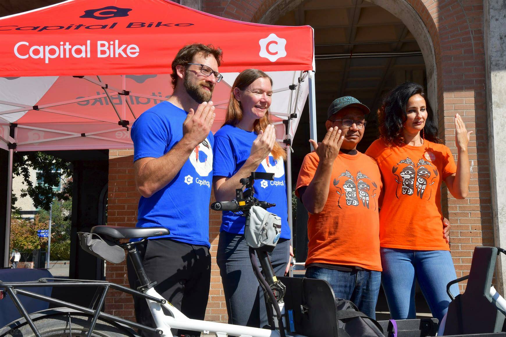 Capital Bike organizers Adam Krupper (left) and Sarah Frumento stand with Eddy Charlie and Kristin Spray of Orange Shirt Day Victoria. (John Holland/Capital Bike)