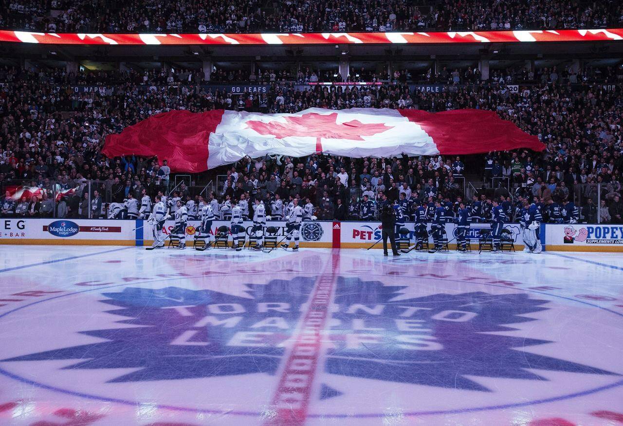 Tampa Bay Lightning and Toronto Maple Leafs players stand for the national anthem prior to NHL hockey action in Toronto on Tuesday, January 2, 2018. THE CANADIAN PRESS/Frank Gunn
