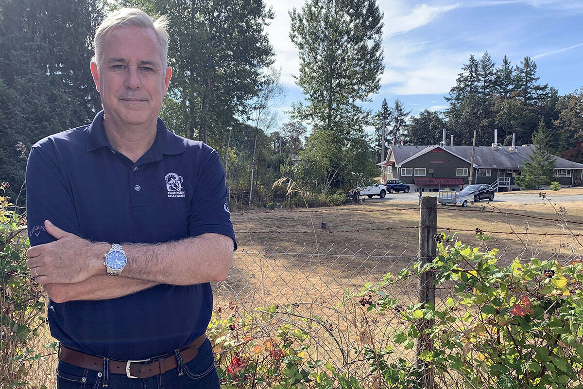 Geoff Wilmshurst, vice-president of partnerships at Camosun College, stands in front of an empty plot of land for which a business case is being assembled for building a film studio. (Megan Atkins-Baker/News Staff)