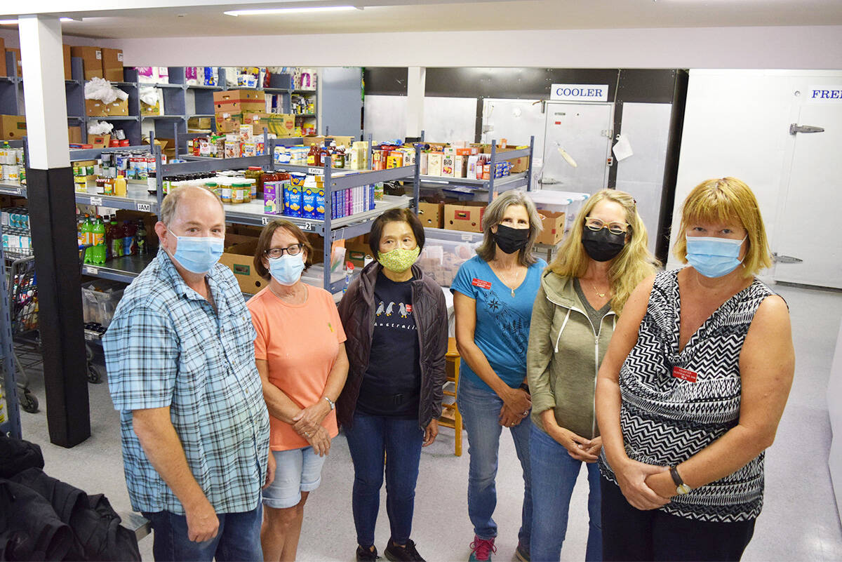 Gayle Ireland (second from the left) with the team of volunteers at Goldstream Food Bank. (Kiernan Green/News Staff)