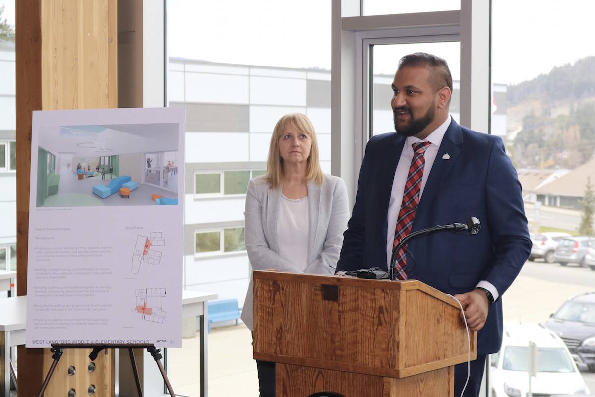 Sooke School District trustee Wendy Hobbs (left) looks on as board chair Ravi Parmar announces the names of two new west Langford schools. The schools are set to open in September 2022. (Black Press Media file photo)