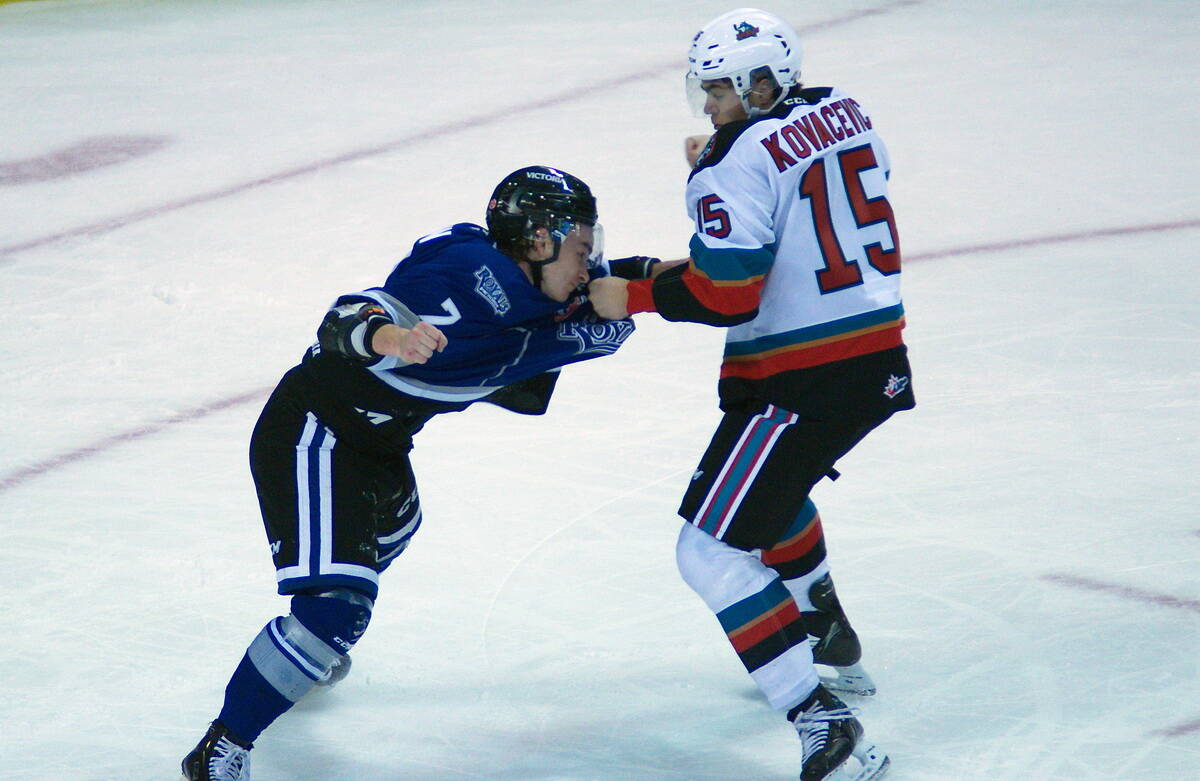 Royals defenceman Devin Aubin and Rilen Kovacevic dust it up after a flurry of second-period goals by the Royals. One of two fights in the game. (Christopher Kelsall/Special to Victoria News)