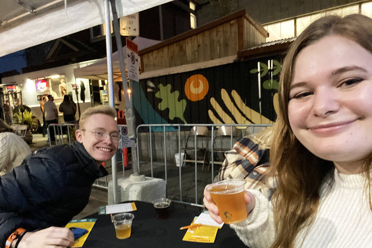 Black Press Media social media specialist Tegwyn Hughes and friend Nathan Rideout enjoy sample brews during the Victoria Beer Society’s Lager Than Life event in the city’s brewery district last weekend. (Tegwyn Hughes/News Staff)