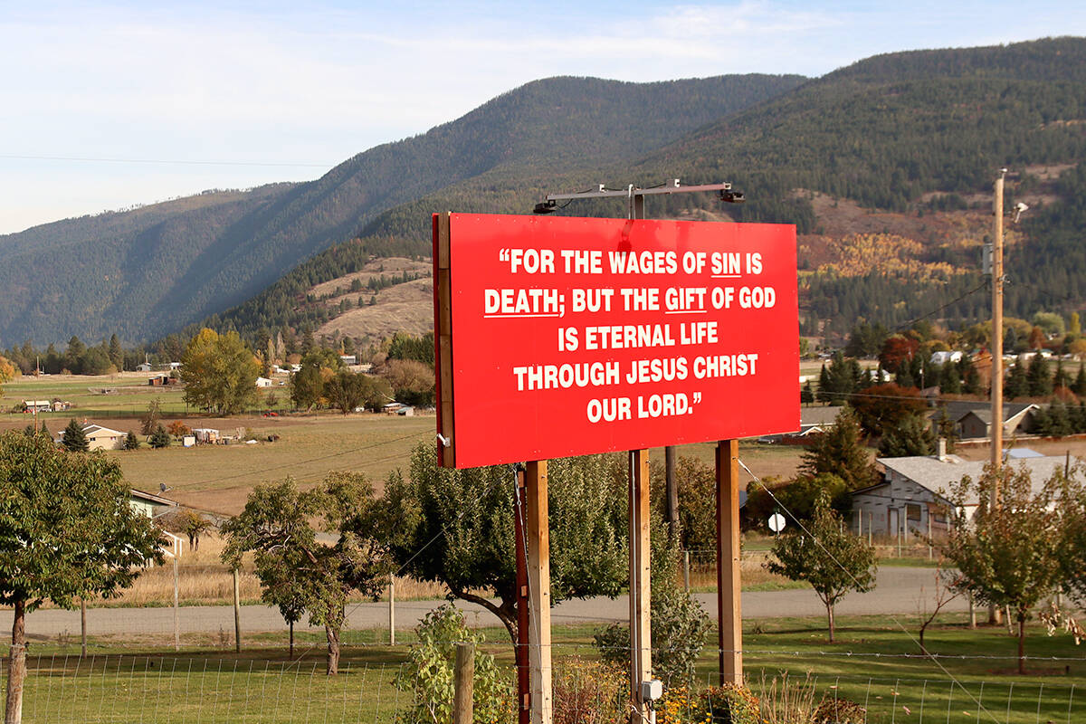 The sign quotes a verse from St. Paul’s Letter to the Romans. Photo: Laurie Tritschler