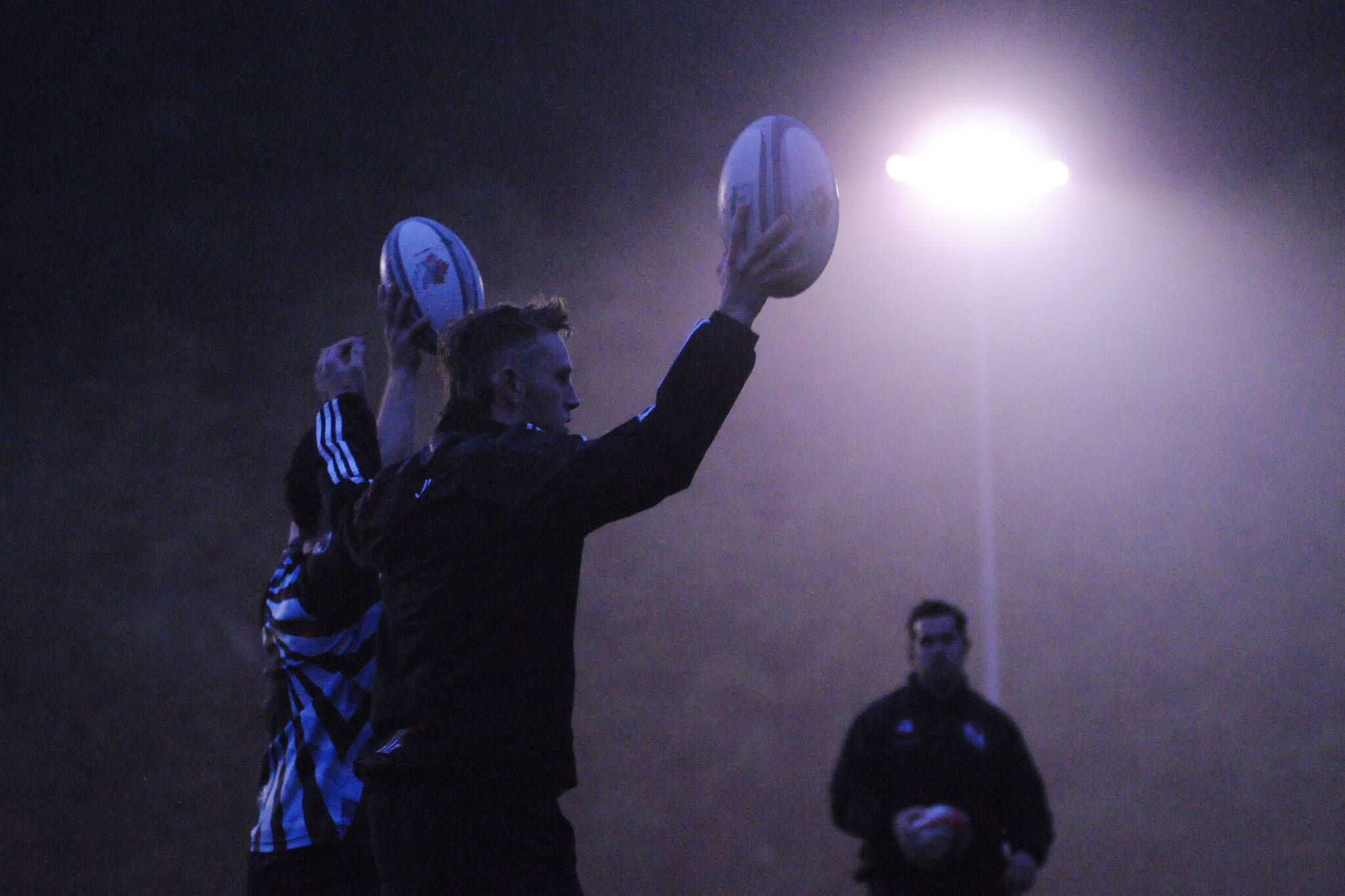Players with the Port Alberni Black Sheep rugby club practice under the lights at the club field on Argyle Street, Oct. 14, 2021. (SUSAN QUINN/ Alberni Valley News)