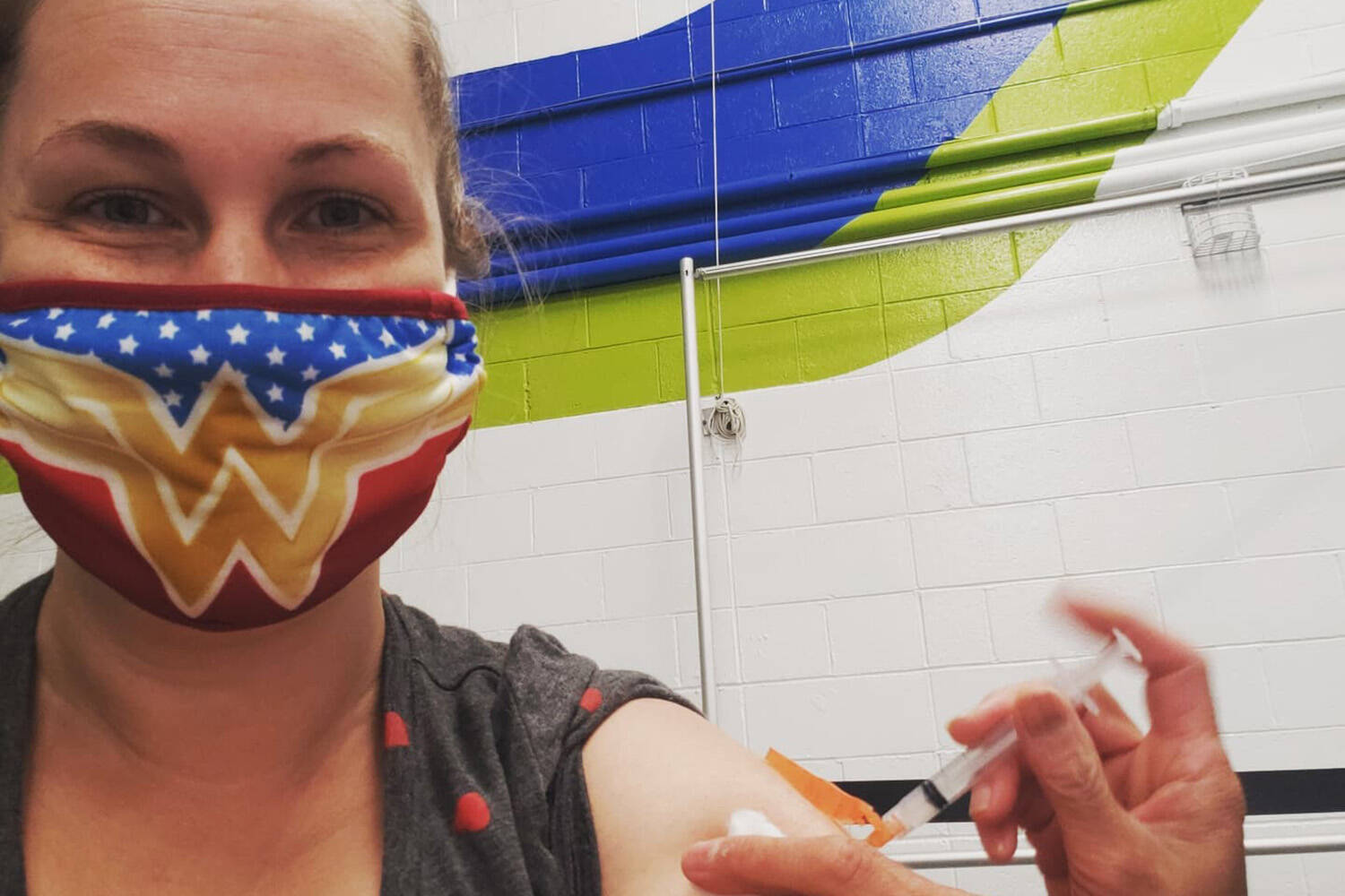 Annie Taal gets her vaccination for COVID-19. Despite a rare allergic reaction the Victoria woman is happy she received the vaccine. (Courtesy of Island Health)