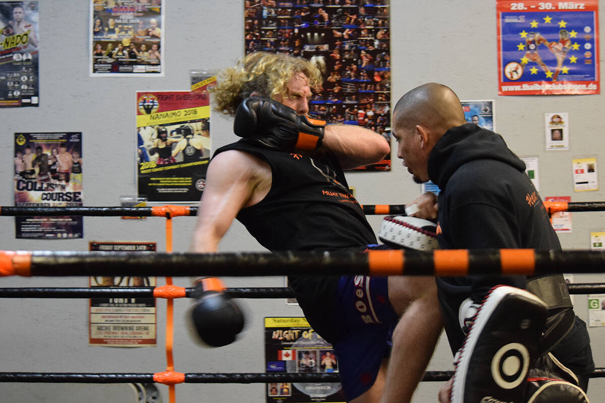Bob MacMillan throws a knee strike at Heart and Soul Muay Thai trainer, Chris Fair, during practice. Ronan O’Doherty/ Campbell River Mirror