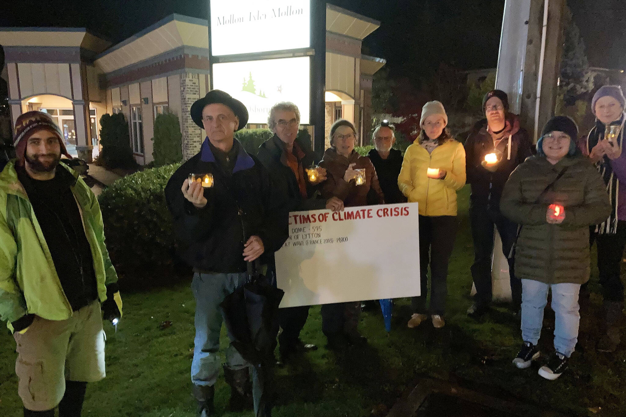 Alberni Valley residents concerned about climate change gather in front of Alberni-Pacific Rim MLA Josie Osborne’s office on Monday, Nov. 1, 2021 to hold a vigil for the hundreds of B.C. victims of June’s heat dome. The vigil will take place every Monday at 7 p.m. (PHOTO COURTESY JOHN MAYBA)
Alberni Valley residents concerned about climate change gather in front of Alberni-Pacific Rim MLA Josie Osborne’s office on Monday, Nov. 1, 2021 to hold a vigil for the hundreds of B.C. victims of June’s heat dome. The vigil will take place every Monday at 7 p.m. (PHOTO COURTESY JOHN MAYBA)
