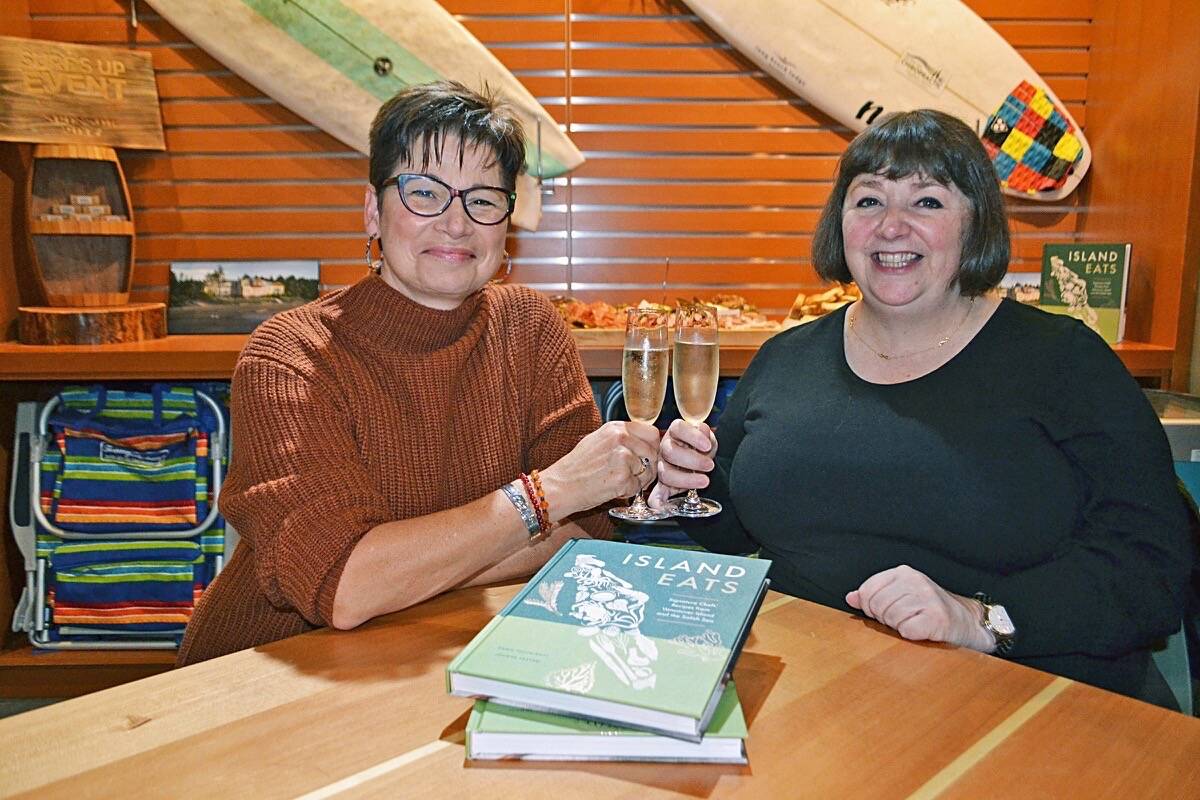 Island Eats co-authors Dawn Postnikoff and Joanne Sasvari toast to the release of their new cookbook during a launch party at Long Beach Lodge Surf Club on Oct. 21. (Nora O’Malley photo)