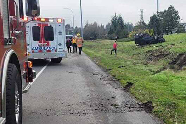 Emergency crews on scene at a single-vehicle rollover crash on the Pat Bay Highway near Vanalman Avenue in Saanich Nov. 29. (Photo by Ryan Gibson)
