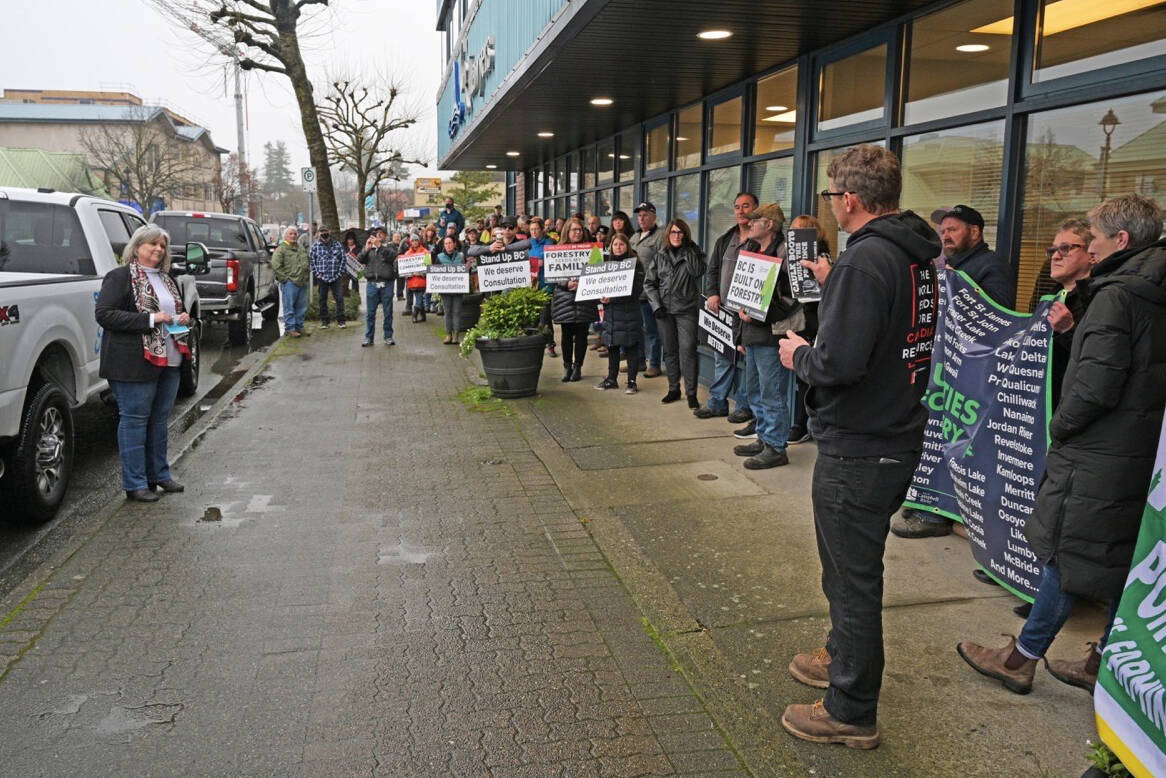 MLA Michele Babchuck (left) listens to Carl Sweet, director of the BC Forestry Alliance, backed by participants of a rally held in support of the forestry industry in downtown Campbell River on Nov. 29. Photo by Sean Feagan / Campbell River Mirror.