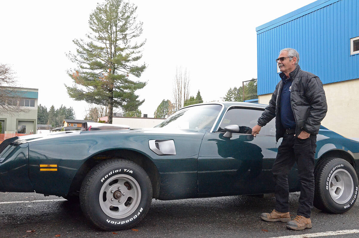 Pat Trask stands by the 1980 Firebird his son put together for him as a morale boost. Photo by Mike Chouinard