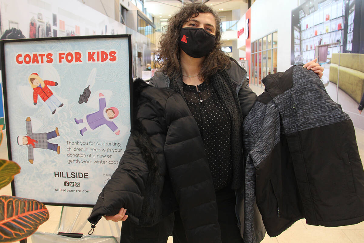 Leila Durzi, a board member of the Victoria Coats for Kids Association, shows off examples of winter coats that are in dire need for kids across the region. Cash and coat donations can be dropped at the guest services kiosk in Hillside Shopping Centre. (Christine van Reeuwyk/News Staff)