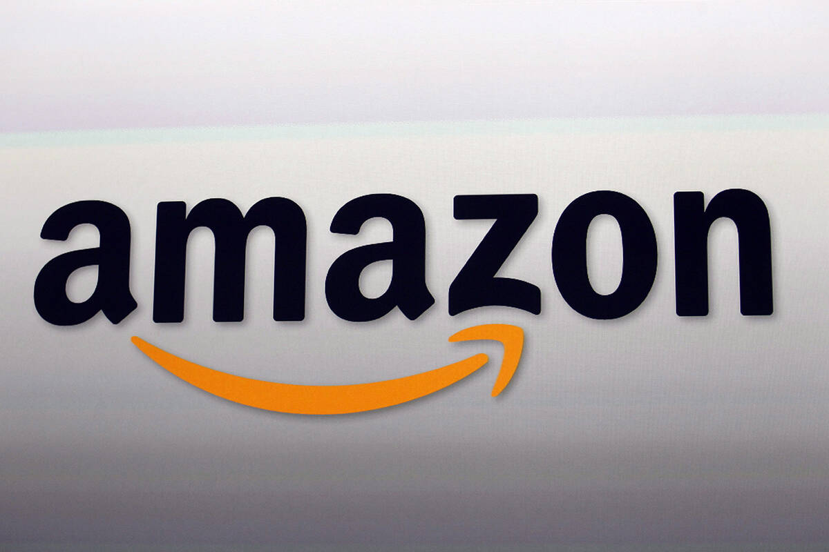 FILE - This Sept. 6, 2012, file photo, shows the Amazon logo in Santa Monica, Calif. Amazon’s cloud-computing service Amazon Web Services experienced problems in its eastern U.S. region, Tuesday, Dec. 7, 2021, causing widespread problems for thousands of websites and apps. (AP Photo/Reed Saxon, File)