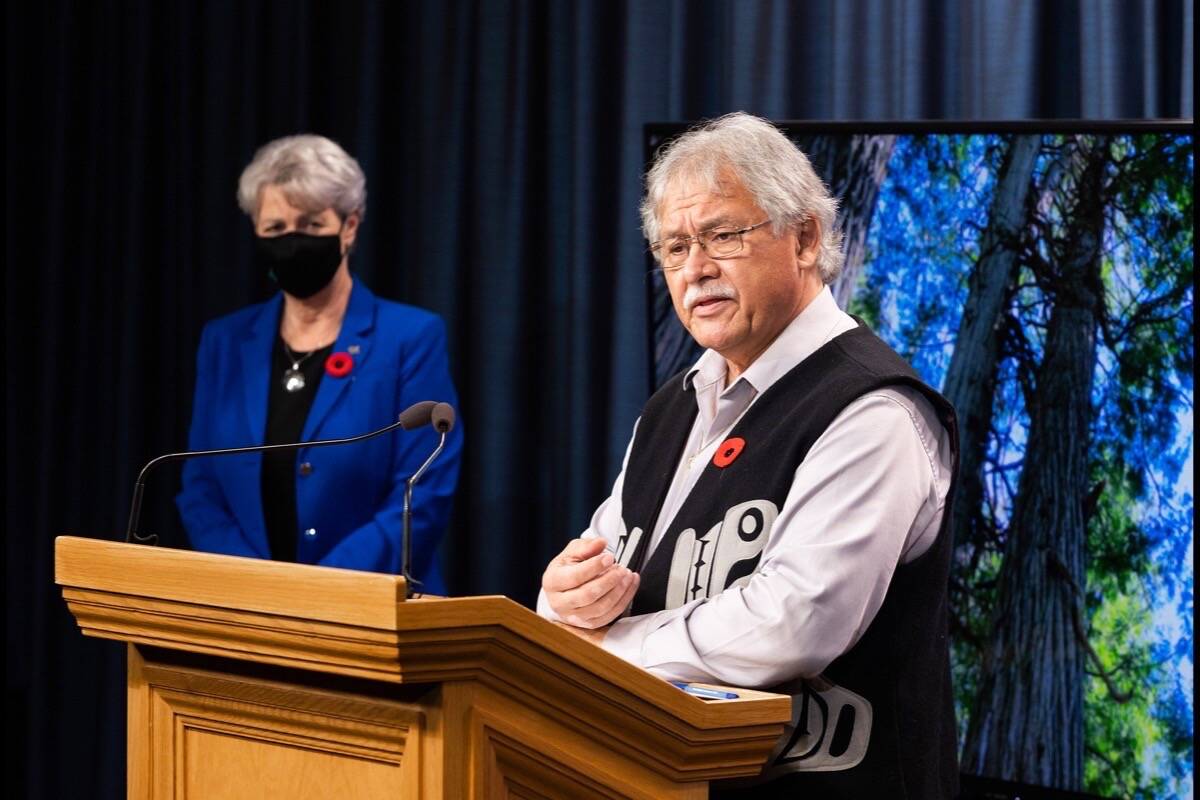 B.C. Forests Minister Katrine Conroy listens as professional forester and Tahltan Nation member Garry Merkel explains the province’s old-growth forest preservation plan at the B.C. legislature, Nov. 2, 2021. (B.C. government photo)