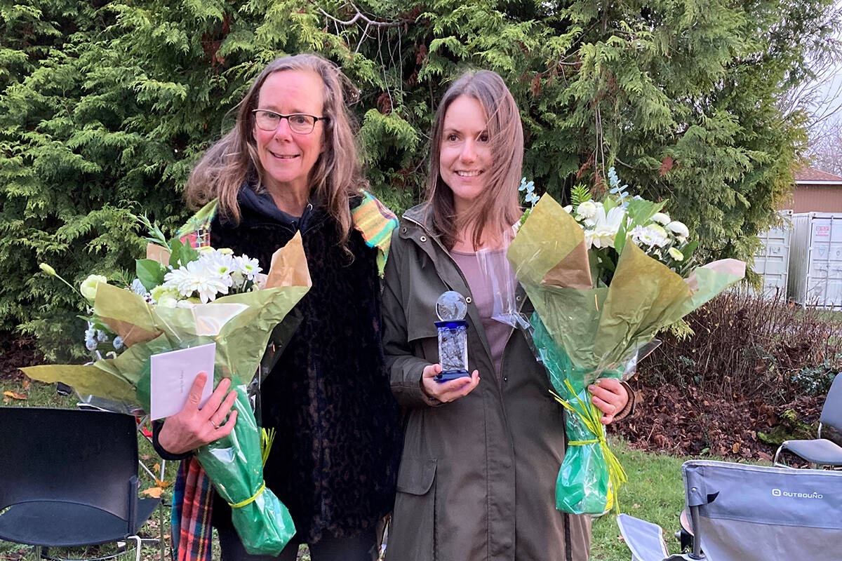 Lifetime Networks of Victoria executive director Wendy-Sue Andrew (left) celebrates fellow staffer Melissa MacDonald, winner of Community Living BC’s Widening Our World award, in a modest ceremony Dec. 8. (Photo courtesy of Caitlyn Sassaman/Community Living BC)